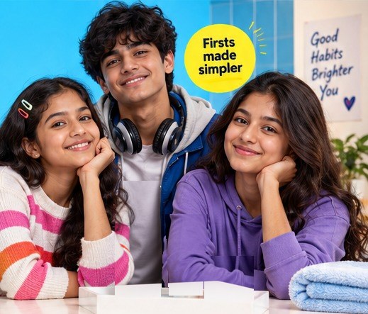 Three smiling Indian tweens and teens leaning together at a bathroom counter